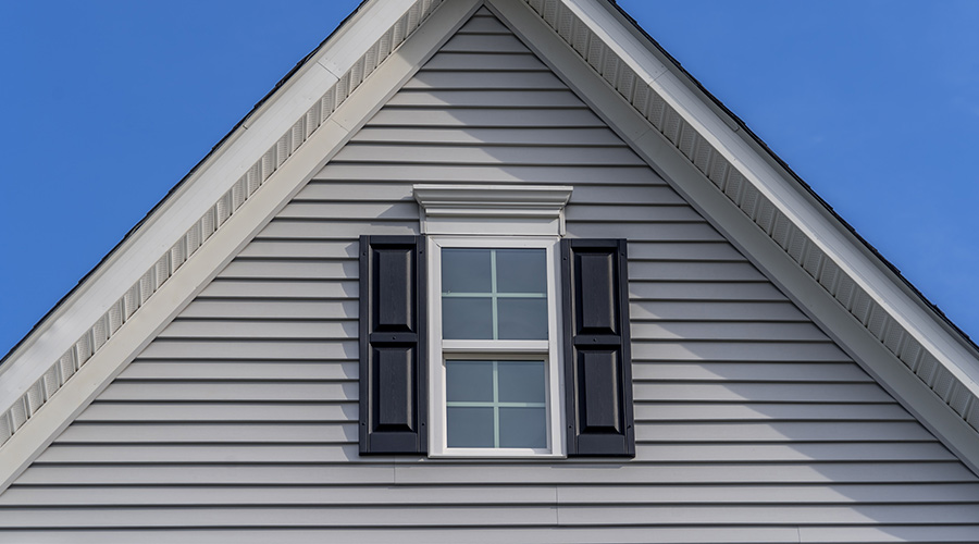 exterior view of window of home with blue shutters taylorsville ut